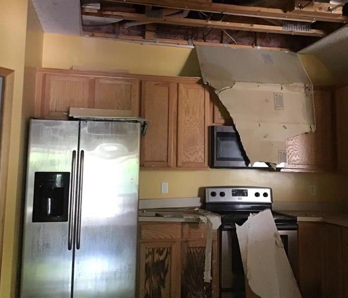a kitchen destroyed by water damage